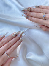 Load image into Gallery viewer, Hand-Painted Elf Wink Stiletto Nails with Sticky Tabs &amp; Kit Y083