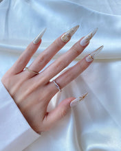 Load image into Gallery viewer, Hand-Painted Elf Wink Stiletto Nails with Sticky Tabs &amp; Kit Y083